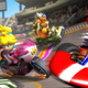 Mario and Princess Peach and Bowser ride go-karts on a race track.